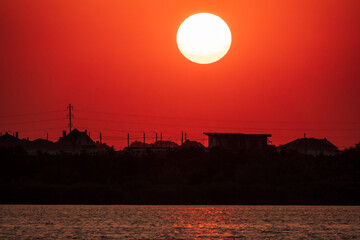 The sun goes down over a lake