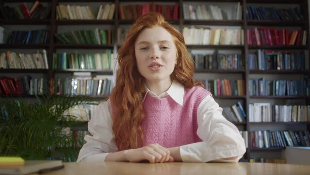 Girl with red hair. young woman school college student learn watching online webinar webcast class looking at laptop elearning distance course or video calling teacher by webcam.