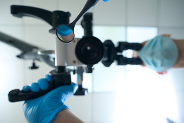 Professional dentist performing dental check-up using diagnostic equipment