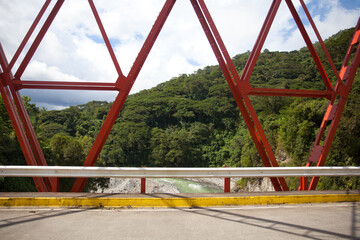 Steel structure bridge close-up. Concrete road and bridge with red beams. Road bridge design. Road...