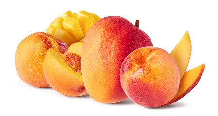 Fresh ripe whole and sliced mango and peaches