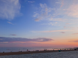 Evening sky over beach, amazing with Colorful Sunset and majestic Sunlight on Twilight ,purple,pink and Blue Nature Dusk Sky Background.cirrus clouds in sunset sky. Atmospheric phenomenon