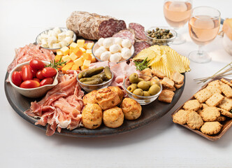 Appetizers table with different antipasti, charcuterie, snacks, cheese. Finger food for buffet party. Traditional french or italian entires. Top view