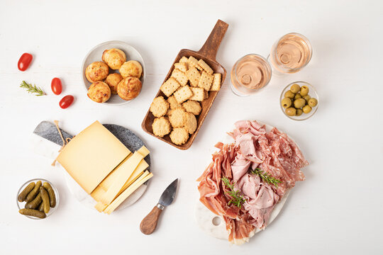 Appetizers table with different antipasti, charcuterie, snacks, cheese. Finger food for buffet party. Traditional french or italian entires. Top view