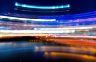 Abstract city night lights illuminated blurred urban background