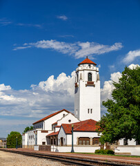 Iconic train depot with blue sky and clouds