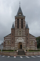 Fototapeta na wymiar Chapelle des Petites Dalles, a catholic church with red and white brick, Petites-Dalles, Normandy, France