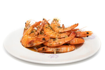 Grilled prawns, with garlic and parsley. Isolated on white background. Spanish food concept.
