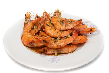 Grilled prawns, with garlic and parsley. Isolated on white background. Spanish food concept.