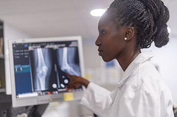 Medical officers consulting each other on x ray results