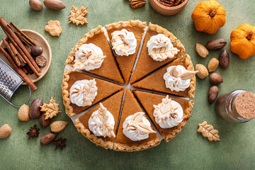 Traditional Thanksgiving pumpkin pie cut into slices