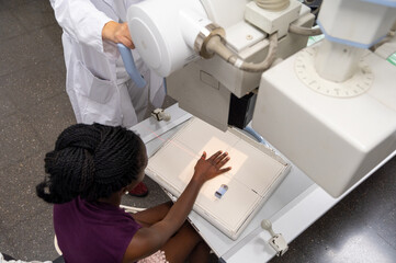 A hand x ray session ongoing in a radiology session