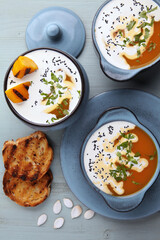 Stylishly distressed vintage brown leather shoes and black jeans isolated on white background.