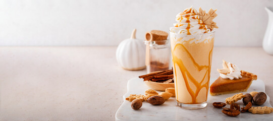 Pumpkin pie milkshake with caramel syrup and whipped cream