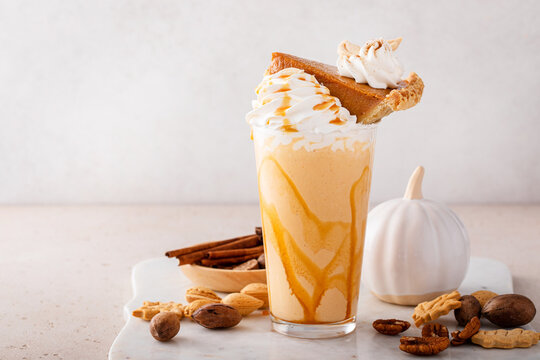 Pumpkin pie milkshake with caramel syrup and whipped cream