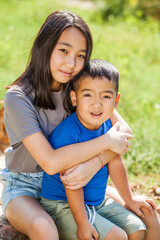 Portrait of a young boy and little girl