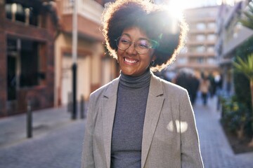 Obraz premium African american woman executive smiling confident standing at street