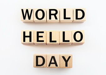 Wooden cubes with text WORLD HELLO DAY on white background