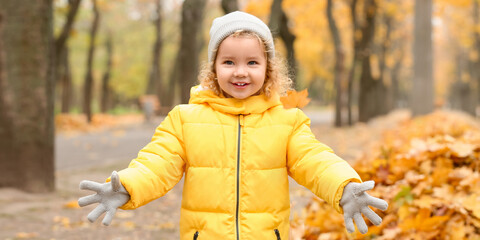 Cute little girl in autumn park