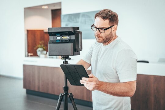 Caucasian Man With Matterport Camera And Tablet Doing 3d Scan Virtual Tour Indoors