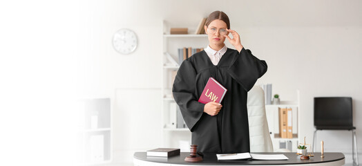 Female judge with law book in office. Banner for design