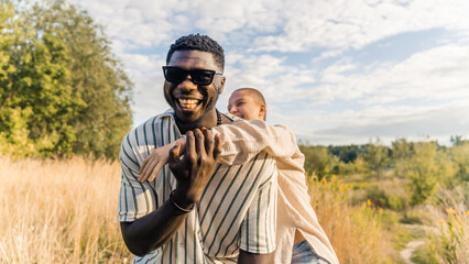 Caucasian woman and Afro-American man having fun together on a trip, friendship concept. High quality photo