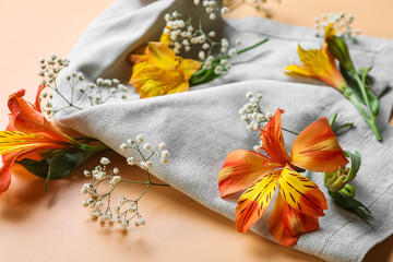 Alstroemeria and gypsophila flowers on color background, closeup