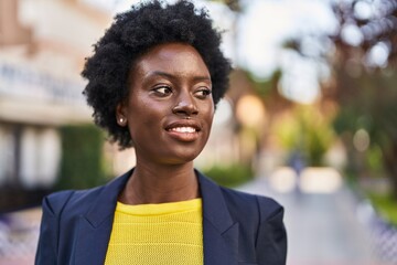 Young african american woman business executive smiling confident at park