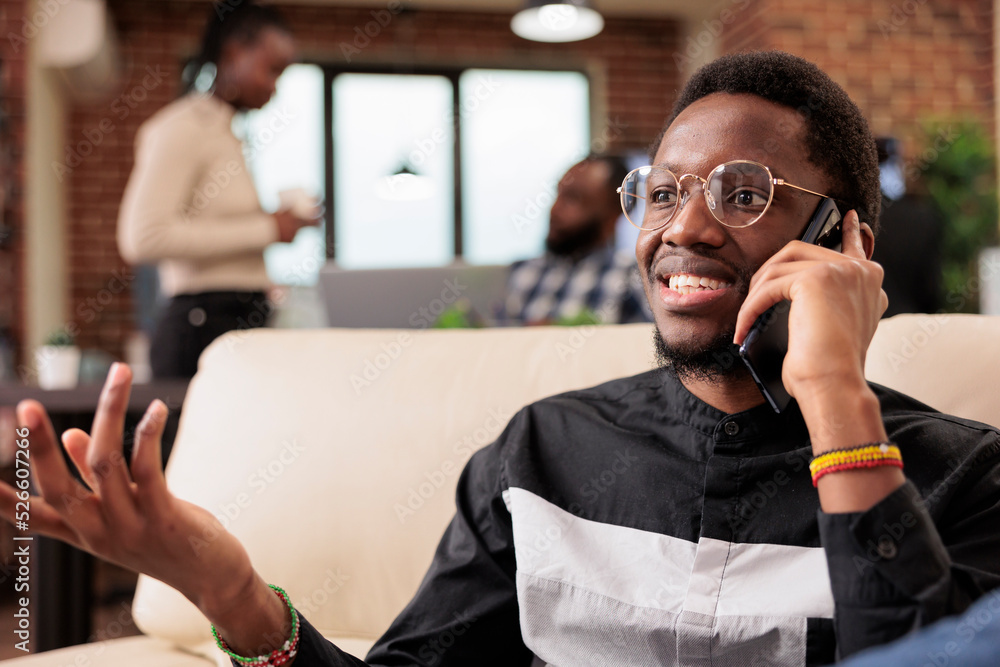 Poster office worker talking on mobile phone call with manager, working on company presentation and busines