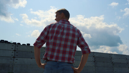 Fototapeta premium Building specialist inspecting construction new technological barn close up.