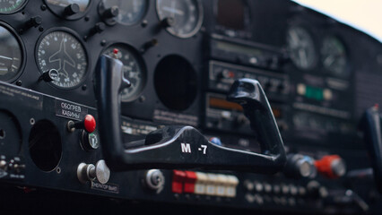 Modern airplane steering wheel inside small private aircraft cockpit close up.