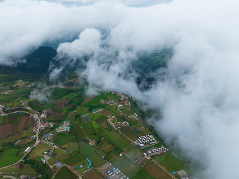 top view aerial shot of village and road mountain above the cloud at Phu tub berk , Phetchabun province , Thailand