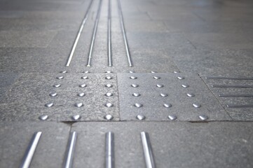 Floor tiles with tactile ground surface indicators, closeup view