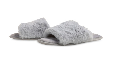 Fototapeta na wymiar Pair of soft fluffy slippers on white background
