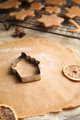 Making homemade Christmas cookies. Dough and cutter on table, closeup