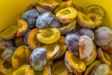 Plum halves . Juicy pulp of plums texture. Farm organic bio fruits.Plums harvest.Plum jam preparation