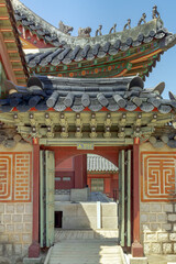 Traditional colorful Korean wooden temple entrance door design at Gyeongbokgung palace Seoul South Korea