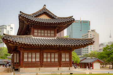 Fototapeta na wymiar Traditional Korean brown wood building at the Deoksugung Palace in Seoul South Korea