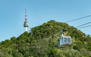 Green forest on a mountain and cable car view of Namsan Seoul tower park in Seoul South Korea
