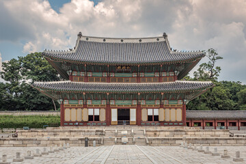 Colorful traditional wood Korean architecture temple building main entrance gate Changdeokgung Palace in Seoul South Korea	
