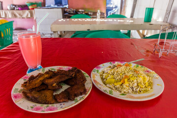 Meal in Berbera, Somaliland - fish with rice and juice