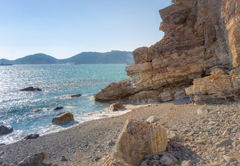Blue ocean water, rocky coastline, and granite cliffs at a beach in Yeongdo Island in Busan South Korea
