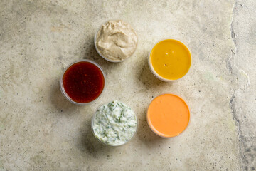 assorted sauces top view on stone table
