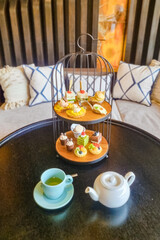 Luxury high tea with snacks and tea in a luxury hotel