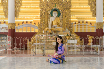 Myanmar woman at Sandamuni pagoda in Mandalay