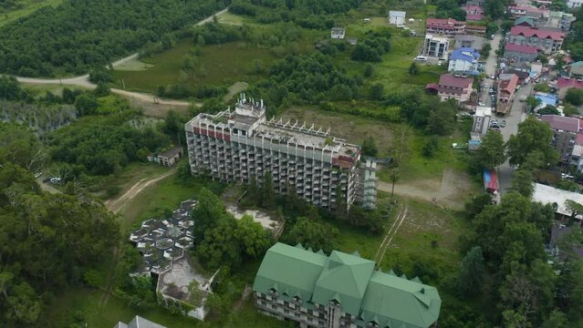 Abandoned Sanatorium Building In Ureki, Georgia. Modernist Soviet Architecture. aerial drone, tilt down forward