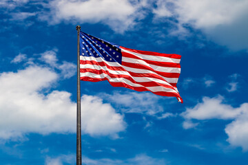 USA flag waving against sky