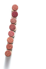 Set wine cork from red wine, bottle stopper top view, close up wood corks red isolated on white background. Natural stoppers with soft shadows. Cut out object for wine card for winemaking or bar