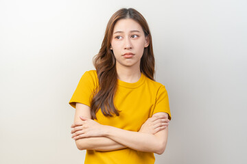 Depressed, distracted asian young woman in casual tired stressed with problem, portrait of brunette with long hair, feeling sad lonely, standing alone avoid looking, isolated on white background. - obrazy, fototapety, plakaty