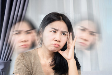 Asian woman suffering from dizziness hand holding her headache and vertigo